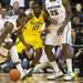 Michigan junior Tim Hardaway Jr. guards Michigan State sophomore Branden Dawson during the first half at Breslin Center in East Lansing on Tuesday, Feb. 12. Melanie Maxwell I AnnArbor.com